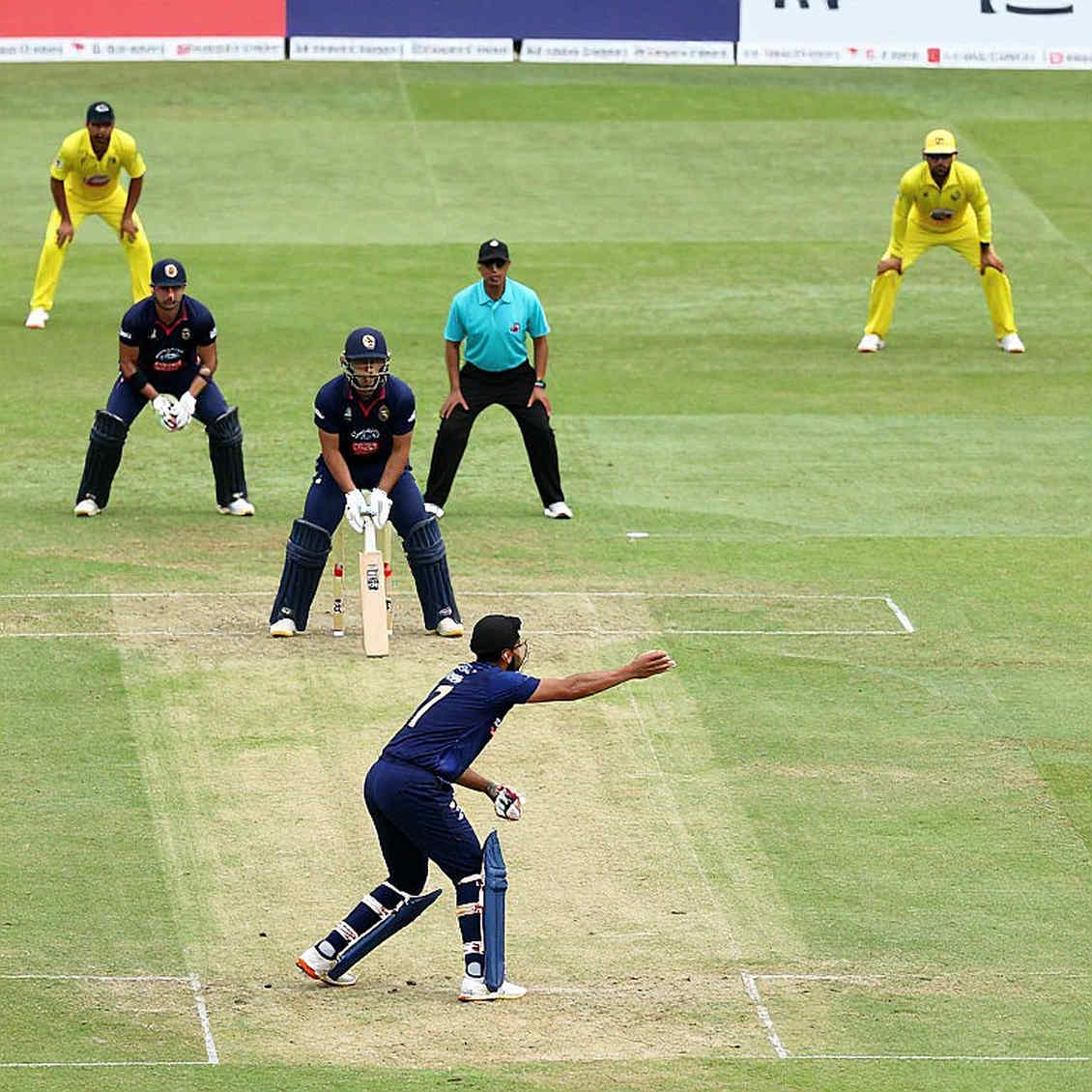 The Missing XI on the World Cup Team Sheet: Reading Cricket's Migrant Labor from an Empty Dubai Stand